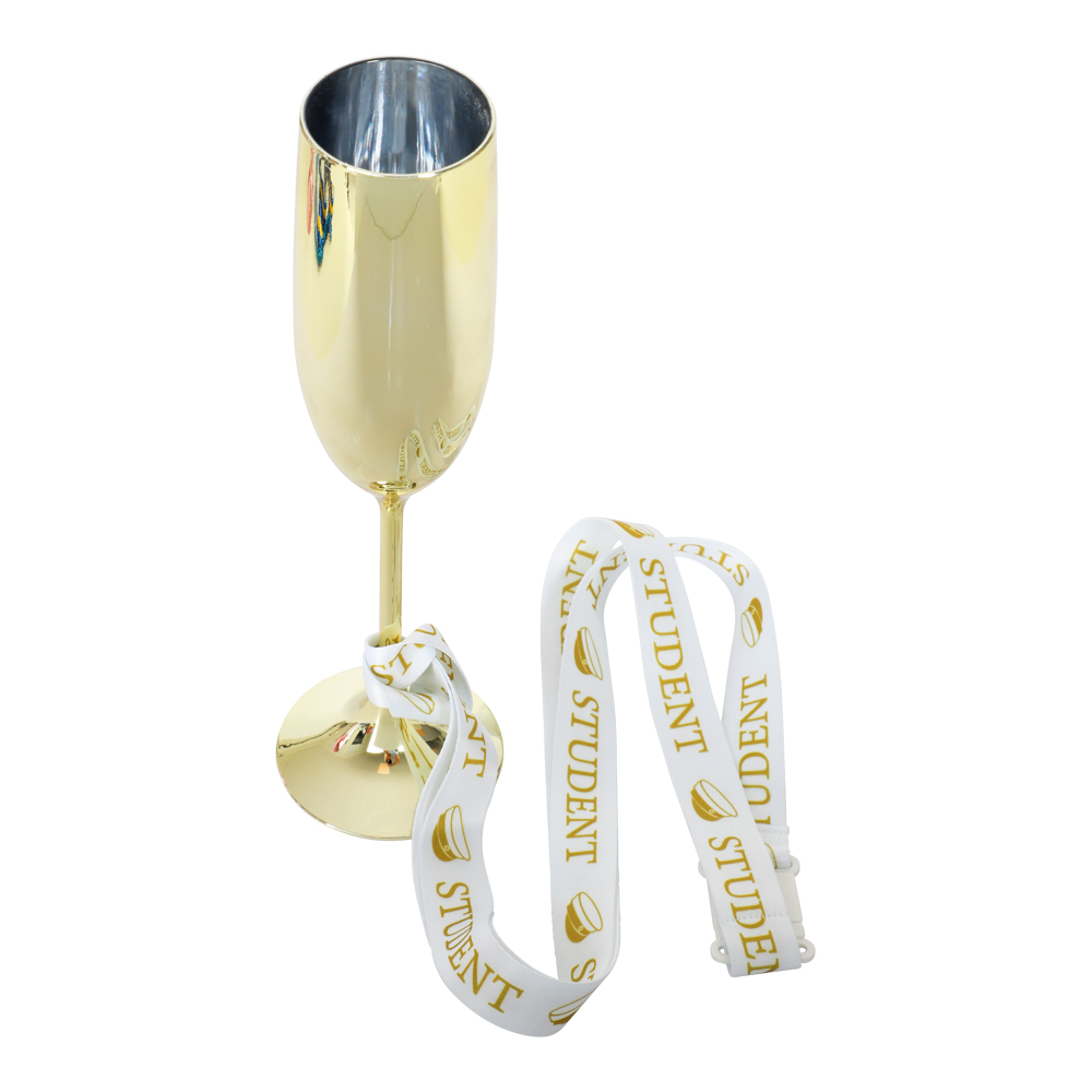 champagneglas i guld med studentband vid foten