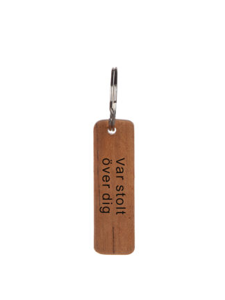 nyckelring i teak "var stolt" 7x2cm
