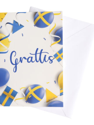 grattiskort student med blå och gula ballonger, svenska flaggor och texten "Grattis" på ett dubbelt kort tillsammans med ett vitt kuvert