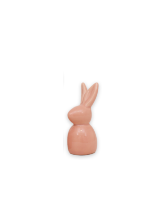 en liten rosa kanin i form av figur med uppåtstående öron på vit bakgrund