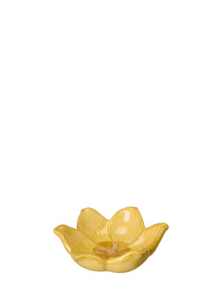 litet blommfat gul format som en blomma med sex vågiga kronblad och blank yta