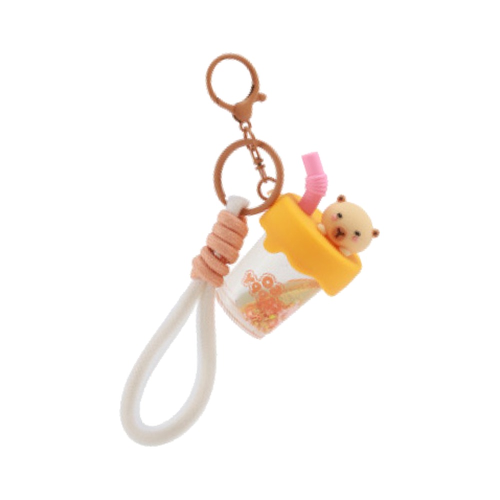 capybara nyckelring med bubble tea-dekoration och vit rem